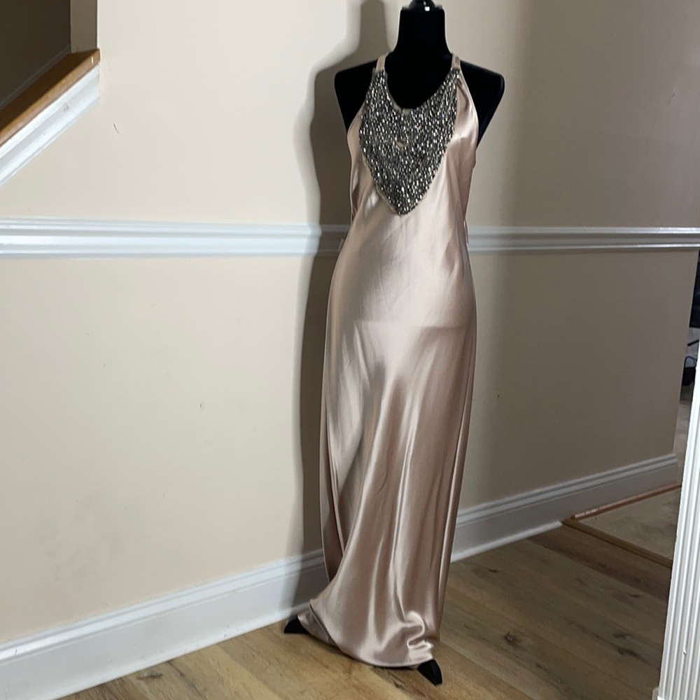 This ABS dress is a size 12 and, never worn.